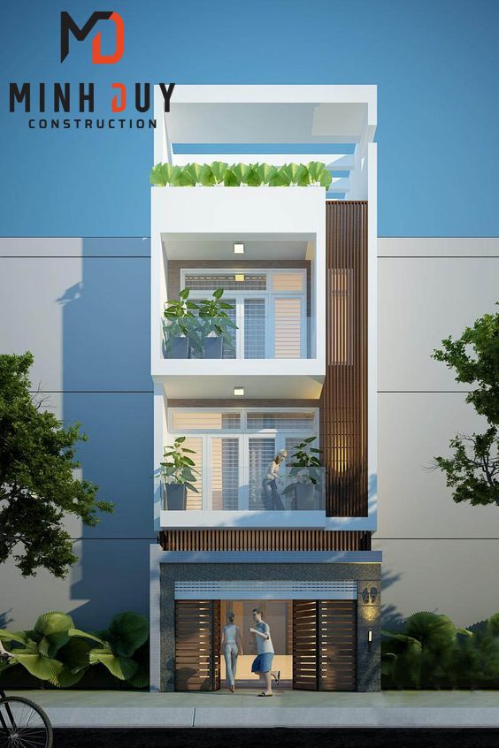 Hình ảnh một mẫu nhà phố hiện đại, mặt tiền đơn giản nhưng tinh tế, có giếng trời hoặc ban công cây xanh